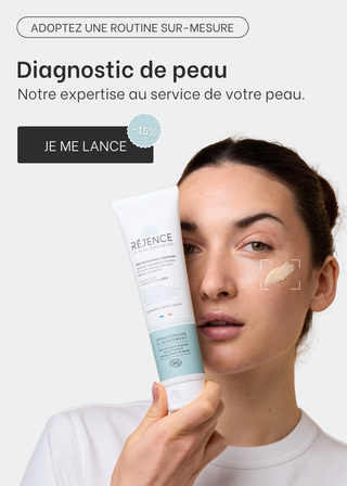 Image d'une femme qui tient une crème Réjence à côté de son visage. Diagnostic de peau -15%
